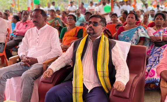 Tripura minister Sushanta Chowdhury listens to PM